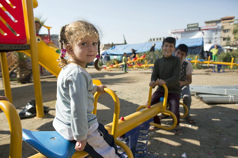 Playground equipment provided by Samaritan’s Purse helps bring joy to children in the camp.