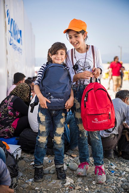 Tala, 11, and Tima, 9, from Syria received backpacks from Samaritan’s Purse on September 17.