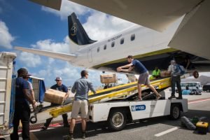 Staff unloading the DC-8 in St. Martin. 