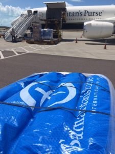 Shelter kits are unloaded from Samaritan's Purse DC-8 aircraft