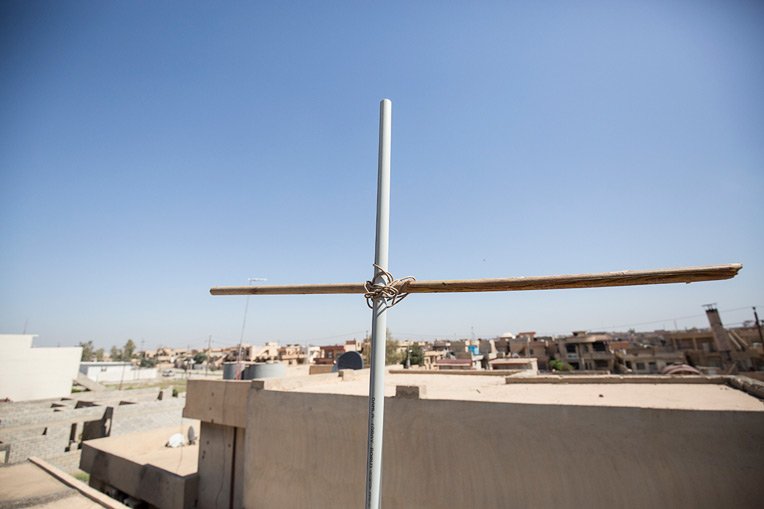 Nabil and his family erected a Cross on top of their home to display their devotion to Jesus Christ.