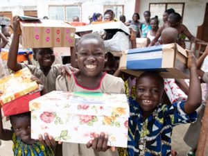 Children with shoebox gifts