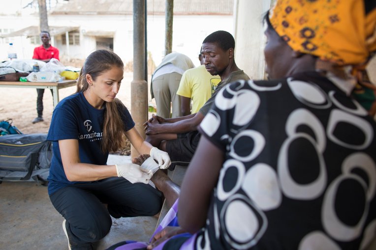 Jessica Lutz, a Samaritan’s Purse nurse, cares for Juliet Luise, a widow. her foot was cut during the cyclone by roof metal. “We are so grateful for Samaritan’s Purse. We thank you so much for coming to visit us and give us medication.”