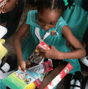 Girl receives barbie doll in shoebox gift