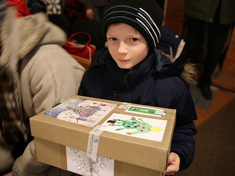 Boy with hand decorated shoebox gift