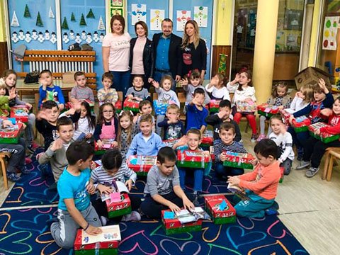Kindergarten class receiving shoebox gifts