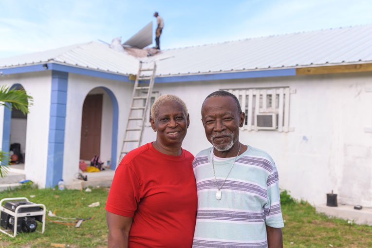 Lisa and Earl Moss rejoice that Samaritan’s Purse worked through local contractors to give them a new metal roof.