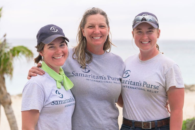 Tyra, Kathleen, and Veronica Esterly enjoy volunteering together with Samaritan’s Purse.