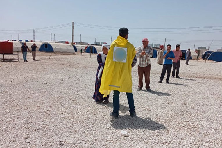 Syrians practice social distancing while waiting in line for monthly food rations from Samaritan’s Purse partners.