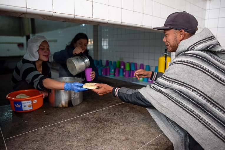 Migrants receive a hot meal at one of our shelters in Colombia.