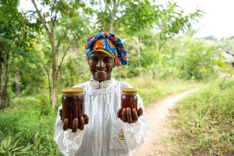 Chizi enjoys harvesting and selling her honey.