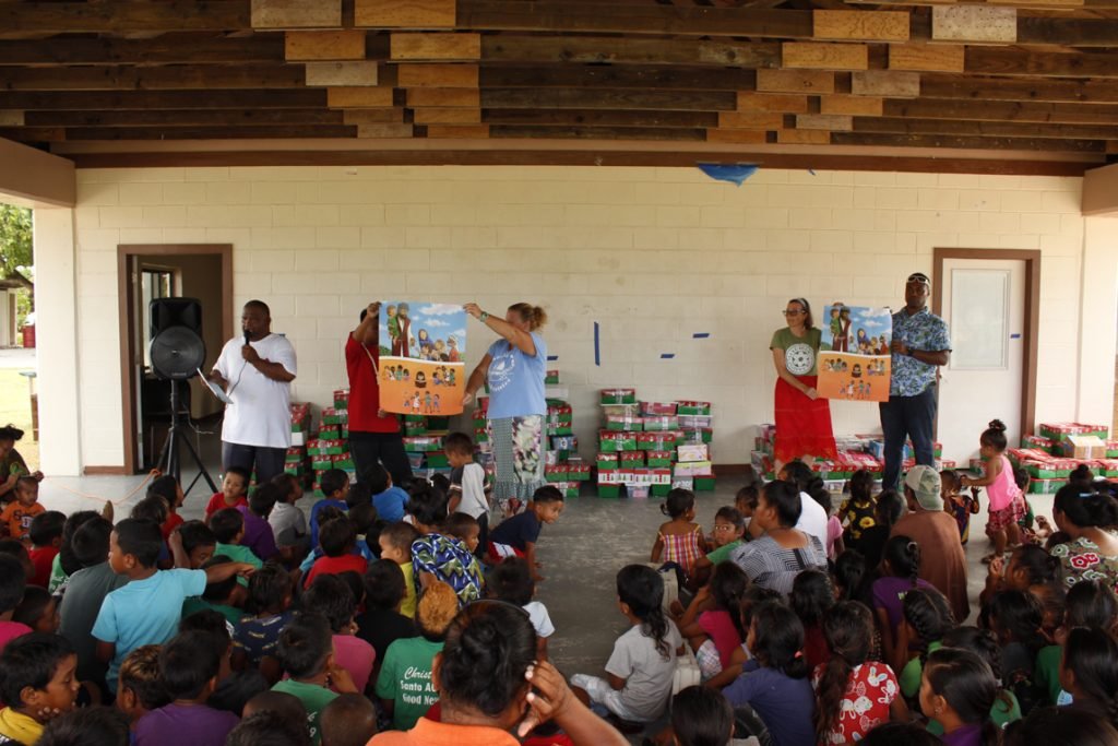 Volunteers presented the Gospel to an eager crowd of children and parents before they distributed the shoebox gifts.