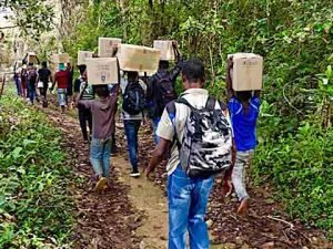 University students transport shoeboxes through the jungle
