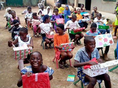 children receive shoebox gifts