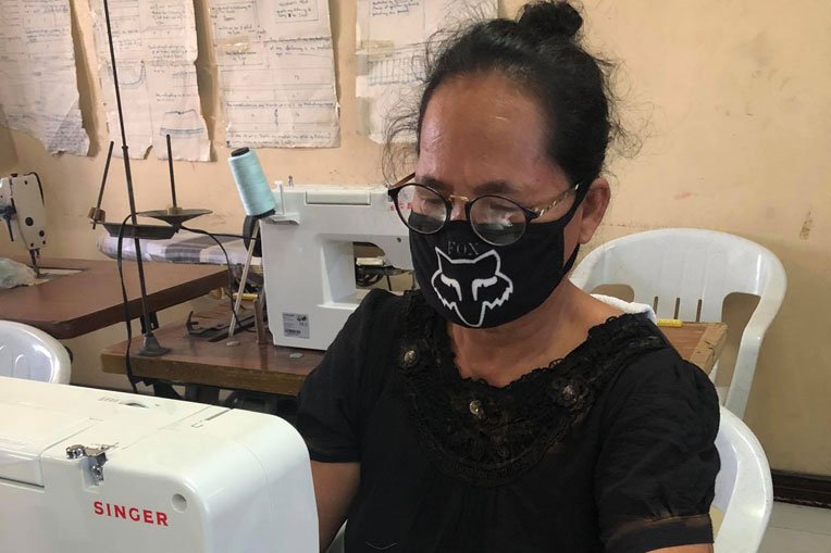 Florencia is helping support her family by making and selling facemasks.