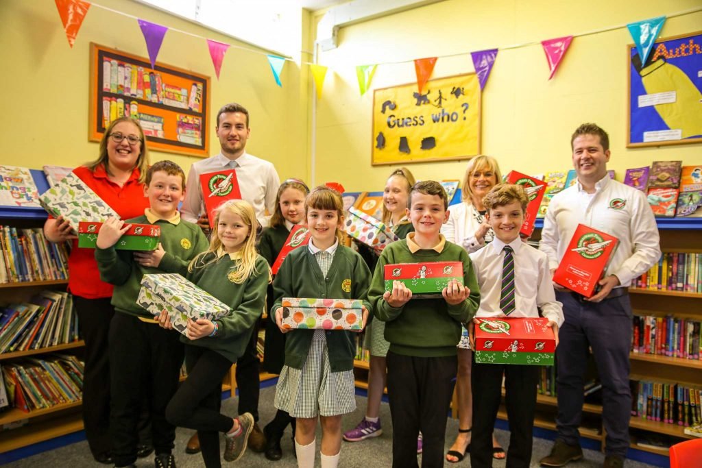 Ballykelly School group holding shoeboxes