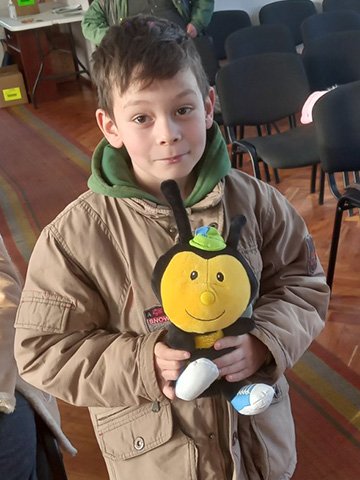 boy with bee toy