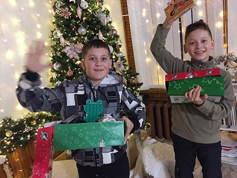 boys show off shoebox gifts