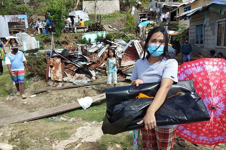 Heavy-duty shelter material is helping to protect families who lost everything in the typhoon.