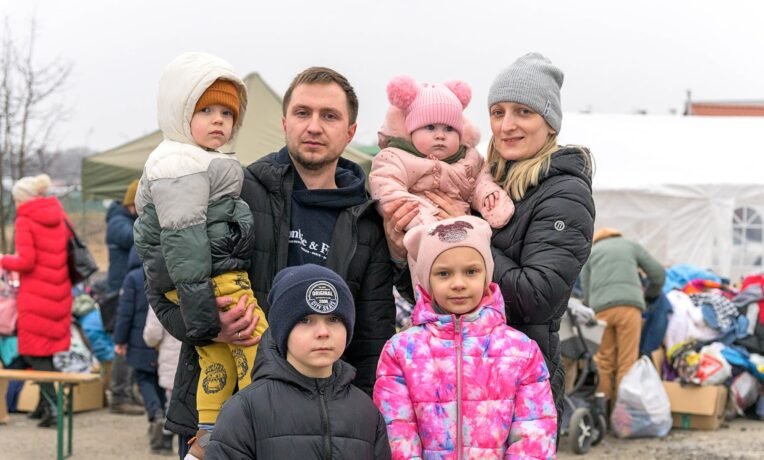 Ukrainian families who've known nothing but peacetime for 30 years are fleeing their homes as their country comes under siege
