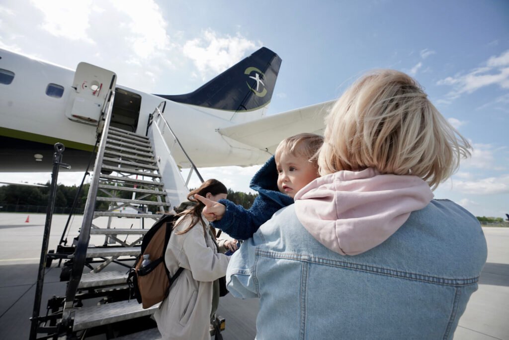 Mothers with children in tow were among the Ukrainians aboard our DC-8 flight to Toronto.