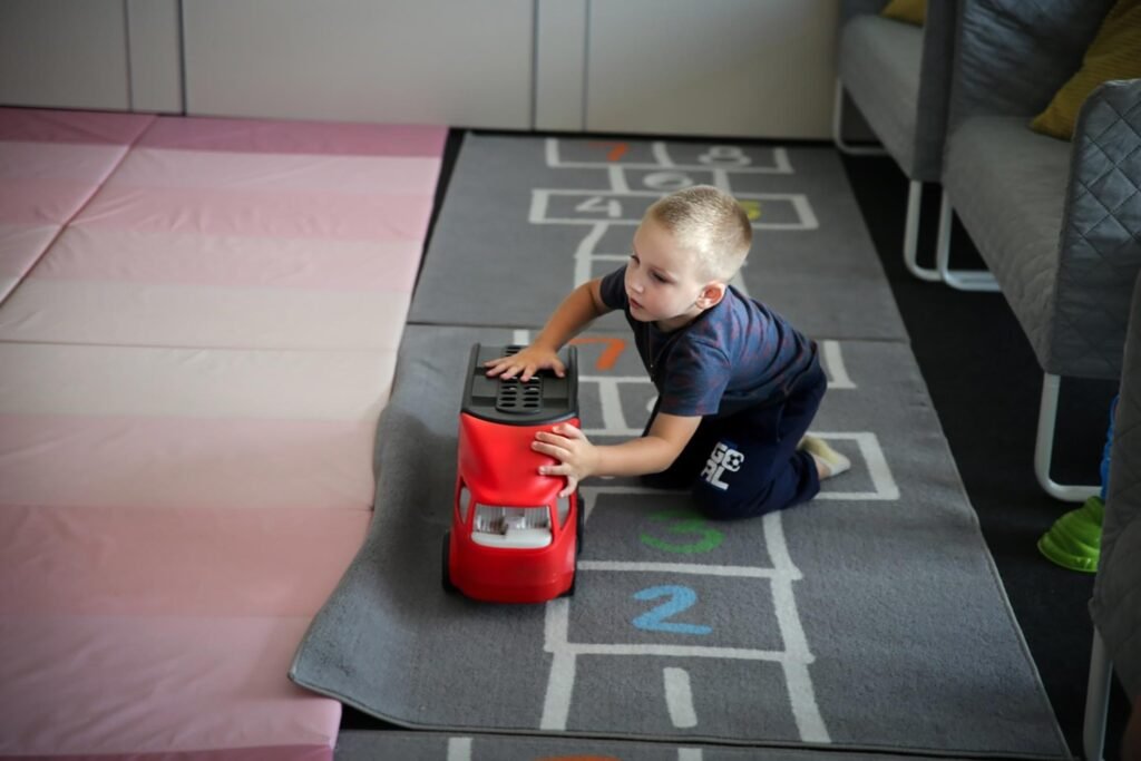 a child playing with a toy lorry at the convention centre in Warsaw that Samaritan's Purse has partnered with local churches to fund a refugee reception centre for Ukrainians fleeing the war.
