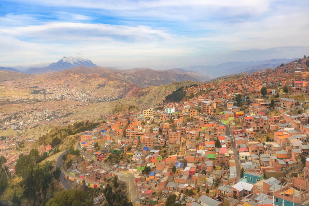 The city of El Alto overlooks La Paz, a larger city, among the high-altitude Andean peaks.
