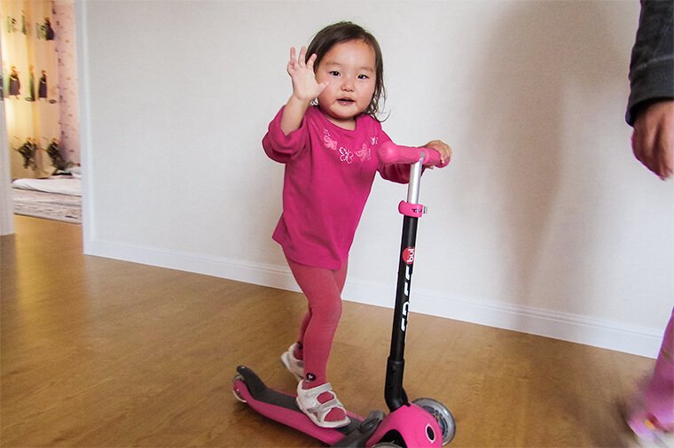 Since her surgery, Enkhsaruul has had energy to run and play like she never had before. Here, she plays on a scooter during a project team follow-up visit.