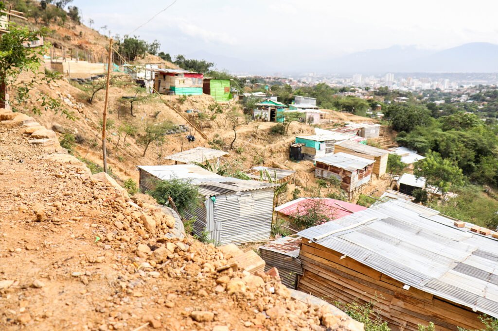 The community of Nueva Alianza continues to grow as migrants build mountaintop structures of wood and metal.