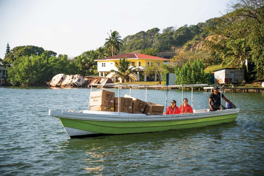 Small boats are used to transport shoebox gifts to remote communities.